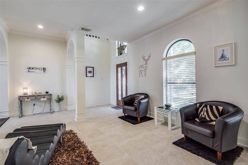 Another view of the formal living area and foyer.