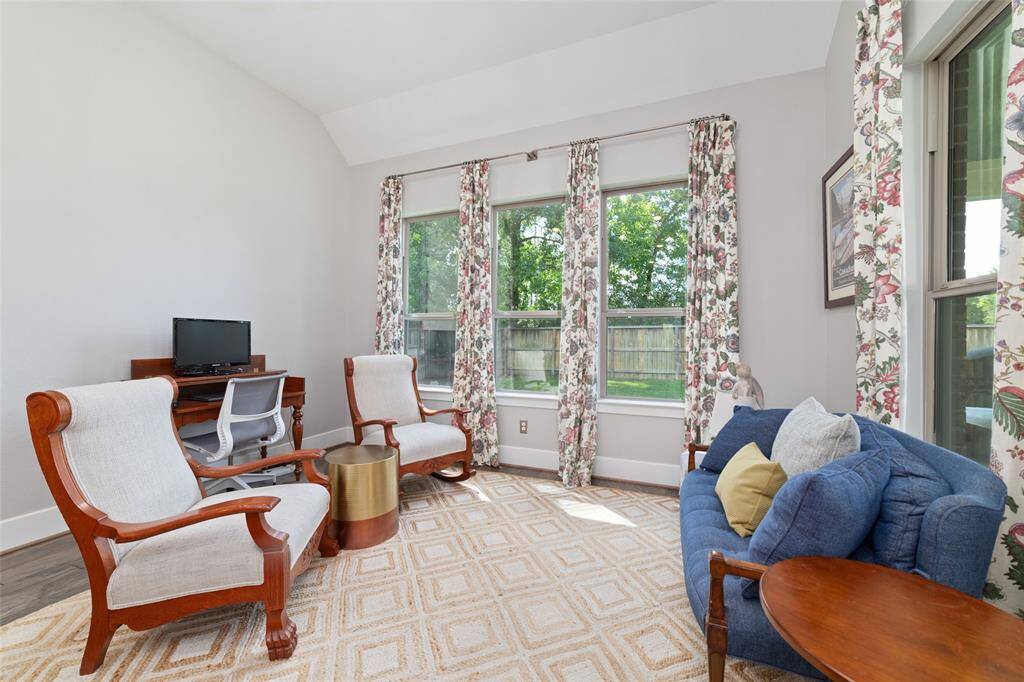 This additional sitting area next to the dining area, is a cozy nook for a cup of coffee, or to sit and listen to birds sing. Many windows to behold the dappled light from the morning sun or evening sunset.