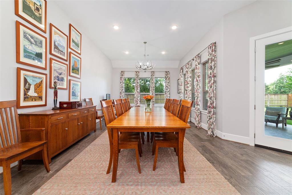 Another view of the beautifully placed dining room currently featuring a stately wood table that comfortably seats ten.
