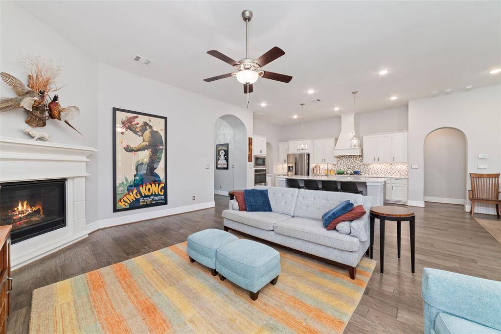 This photo showcases the seamless flow between the kitchen, dining, and family room—classic and elevated,  perfect for both entertaining and everyday living.