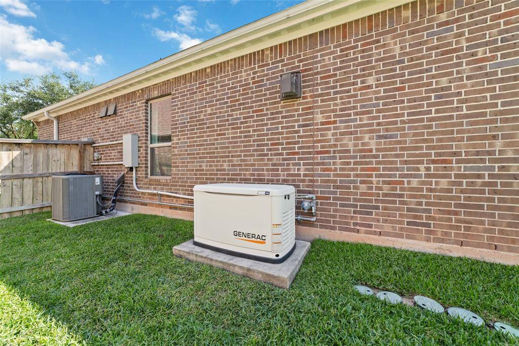 A whole home generator was installed for this home, ready to power up in case of an outage.