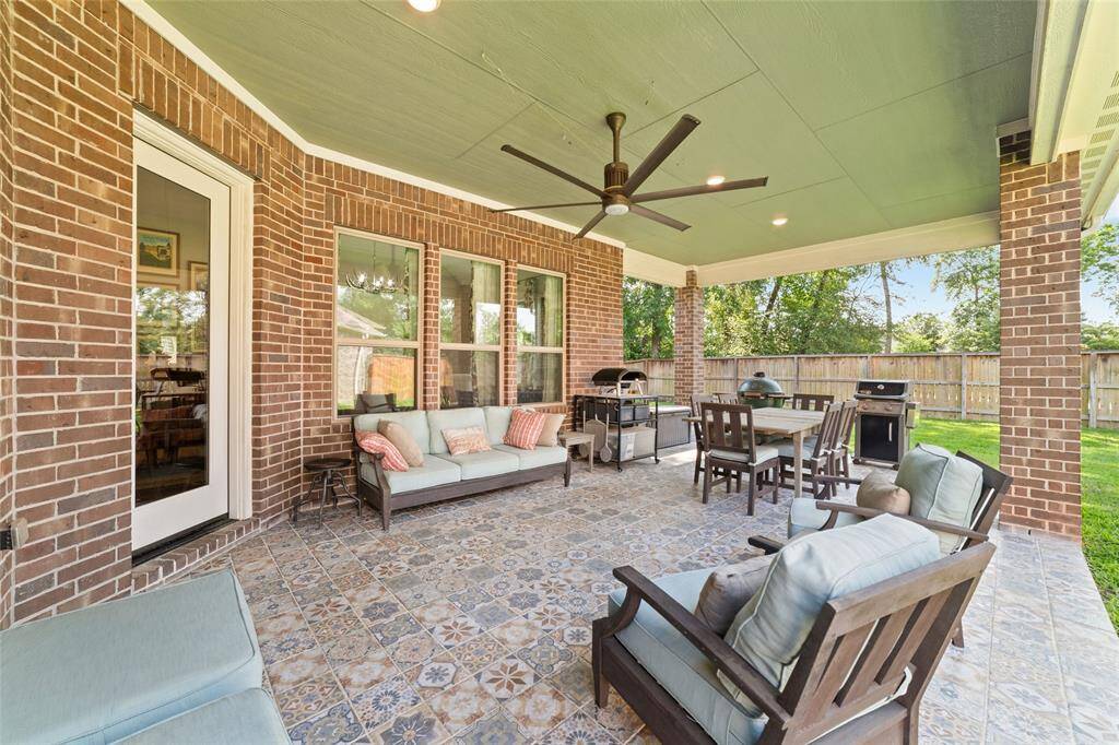 Another view of the covered patio space, perfect for hanging out outside and enjoying a barbecue with family and friends.