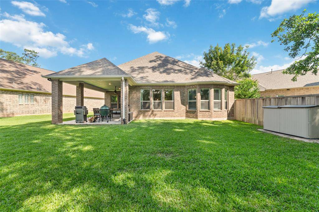 A shed sitting on a pad of concrete at the backyard, great for additional outdoor storage. The home has gutters all around the home.