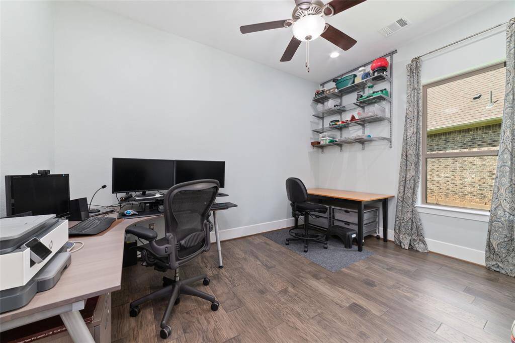 Second guest bedroom with walk-in closet currently being used as an office.