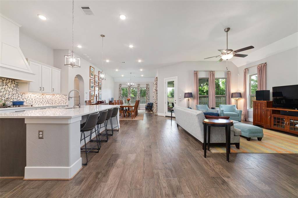 The open concept living, kitchen and dining space is the heart of the home.