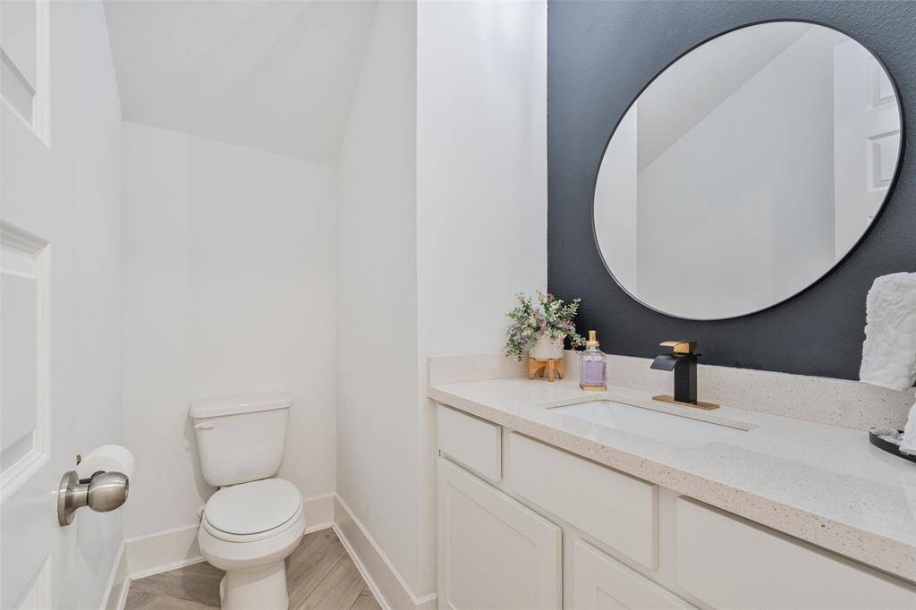 You will find a Half bath located near the dining area and living area.