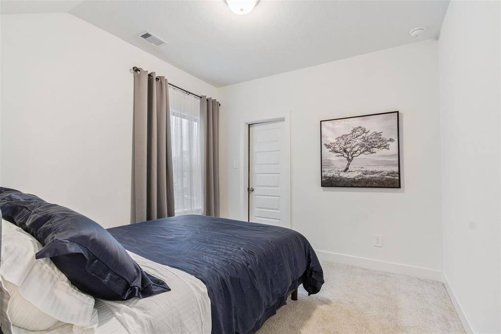 One of three bedrooms on the second floor with nice walk in closet.