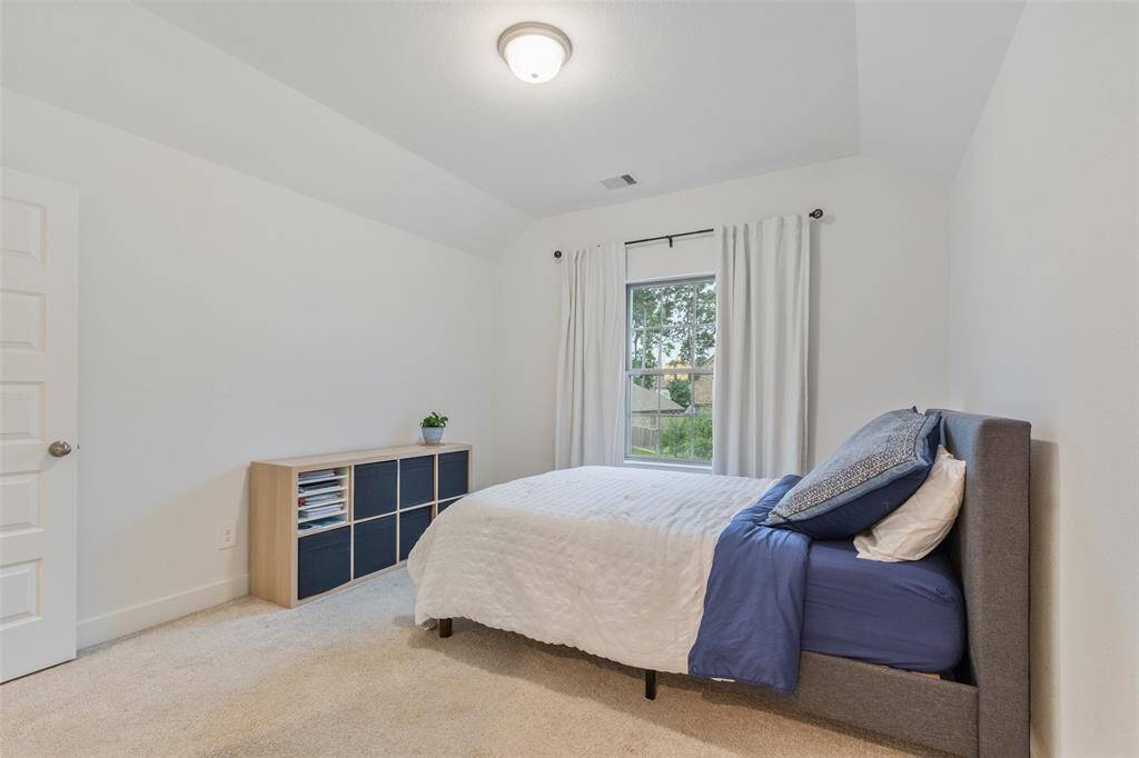 The third bedroom on the second floor, with a private bathroom.