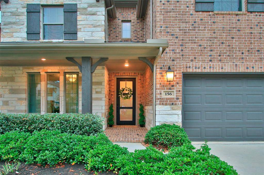 You will be welcomed home to this wonderful entry with Elegant lantern lighting, and a modern black door.