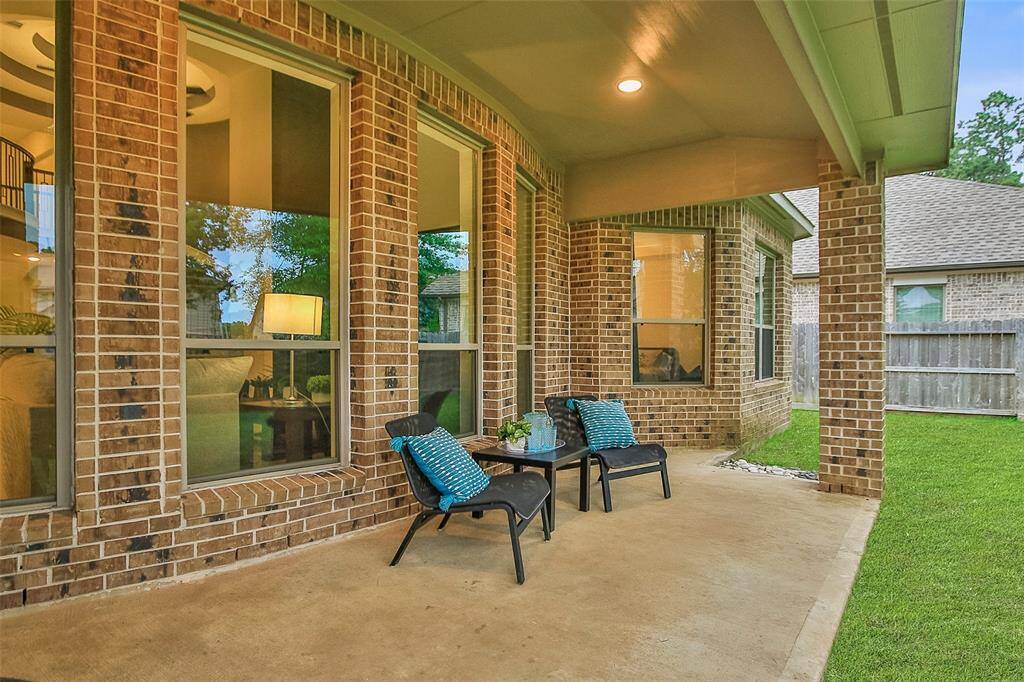 You will enjoy your morning coffee on the covered patio overlooking your back yard.