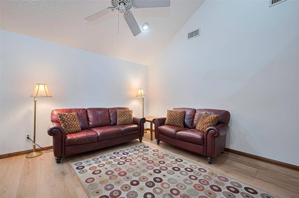 The family room is warm and cozy, with excellent wall space for arranging furniture to suit your needs. Tall walls provide plenty of room for displaying artwork, family photos, or treasured mementos, adding a personal touch to the space. The interior was painted in 2019, with some rooms painted more recently for an even fresher look.