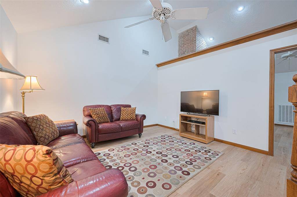 The family room, measuring 15' x 13', can easily accommodate a sectional sofa if desired. The wall between the family room and living room defines individual spaces, but both rooms are versatile and can be repurposed depending on a family's needs. Perfect for customizing the layout to suit your lifestyle.