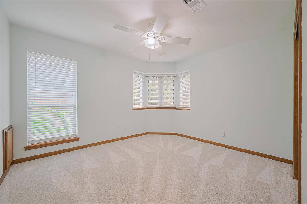 Bedroom #2, measuring 12' x 10'11", features charming original leaded glass corner windows. These were the only windows not replaced in 2018, as the owners wanted to preserve this unique feature of the home’s front facade.