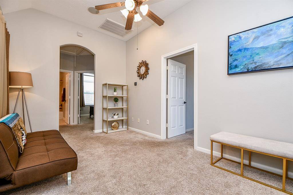 Another view of FLEX SPACE- picture taken from stairs. (Master bedroom, right door, and arched door way leads to guest bedroom, bathroom, and utility area.)