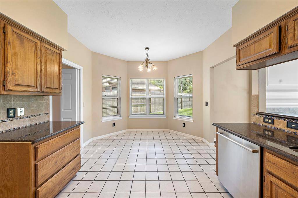 The breakfast nook is located right off the kitchen area open to the main living area. The windows bring in a generous amount of natural light.