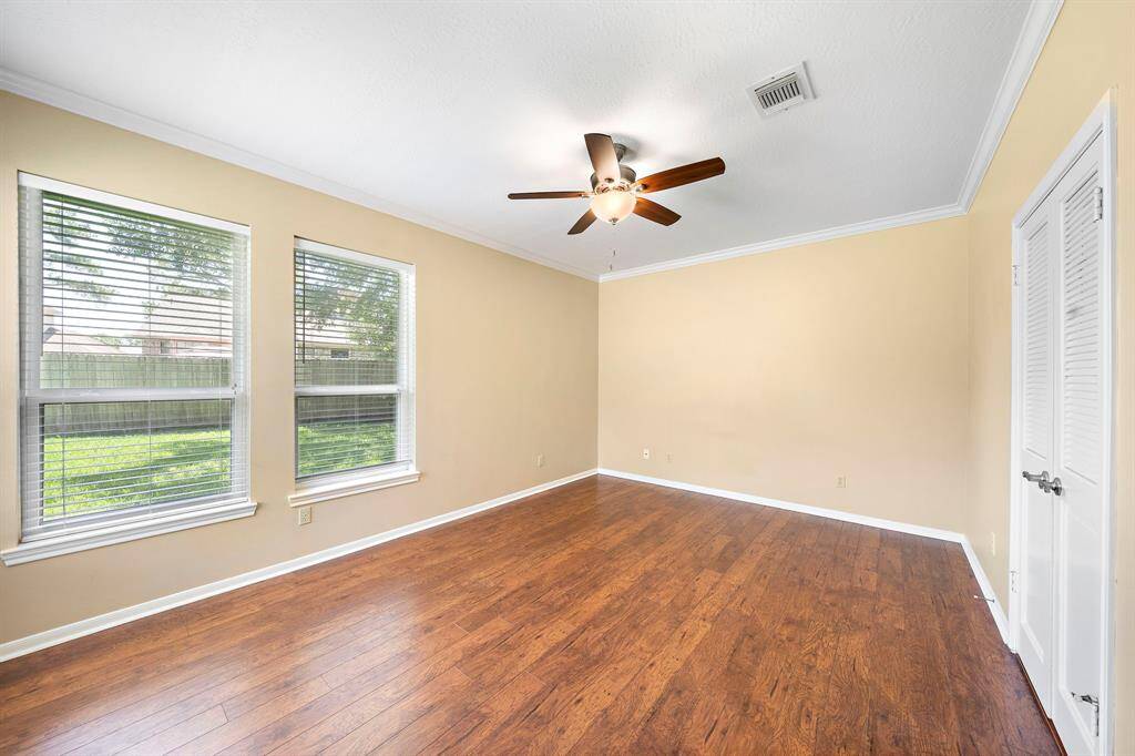 The primary bedroom has amble space for a king sized bed and other furnishings.