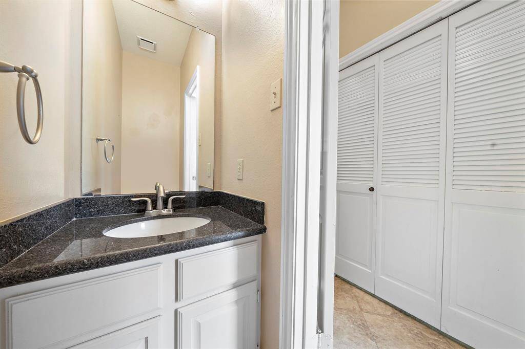 The half bath is conveniently located across from the laundry room around the corner from the main living space.