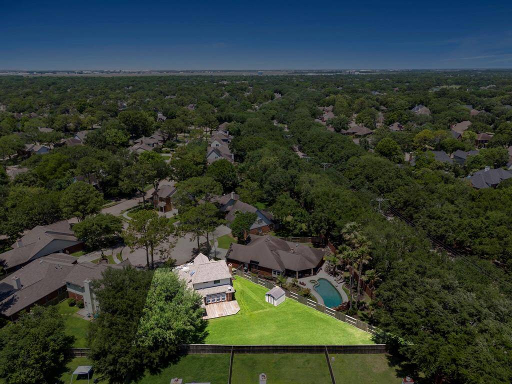 Aerial view defining the large size of green space behind the property.