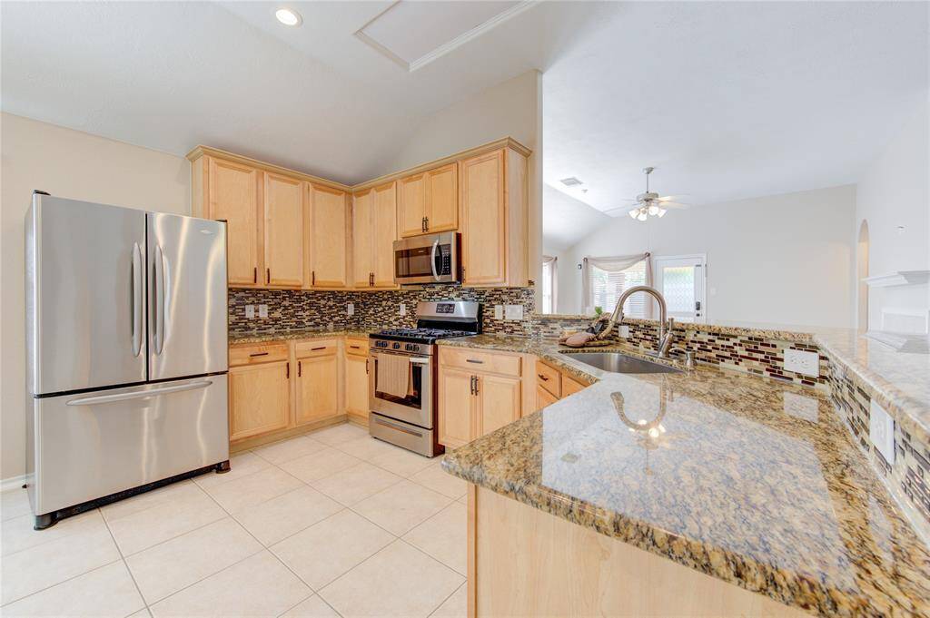 fully loaded kitchen with stainless steel appliances