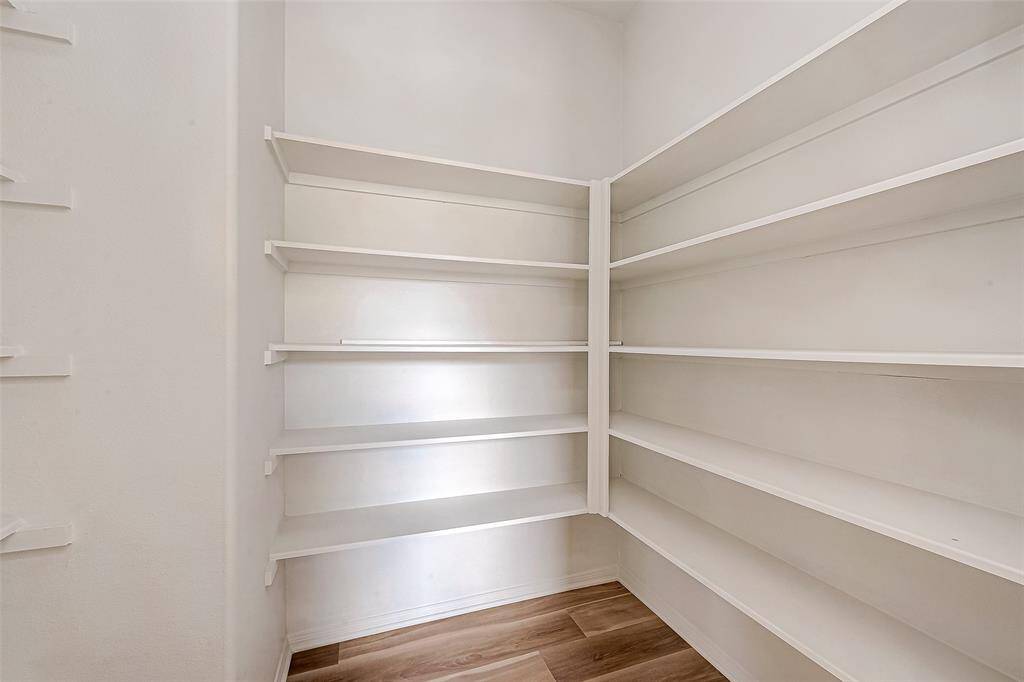 Spacious walk-in pantry for ample storage and organization.
