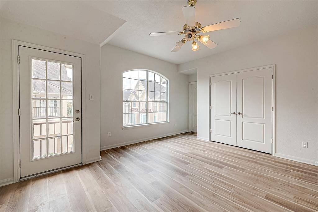 Spacious secondary bedroom with an en-suite bath and private balcony.