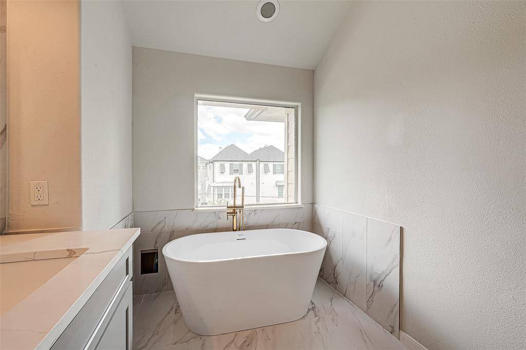 Indulge in relaxation with this elegant soaking bathtub, perfectly positioned for serene views.