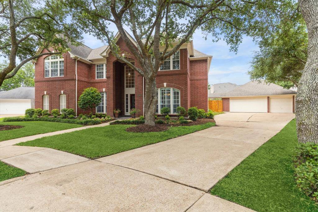 3 car garage offers parking and storage for everyone!
