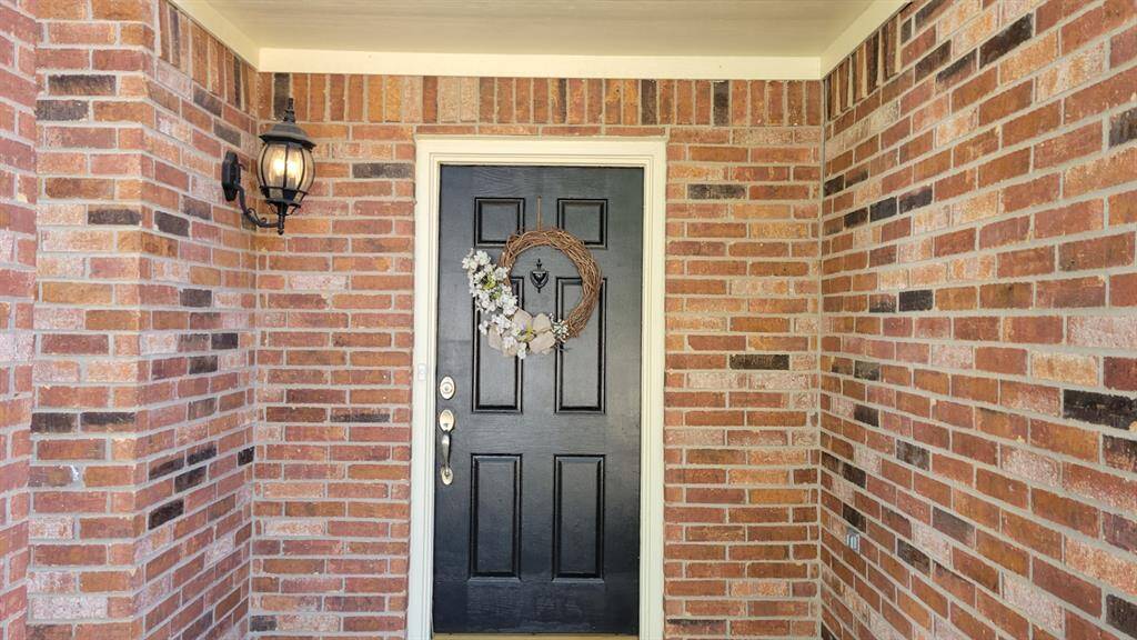 FRONT DOOR WITH COVERED ENTRANCE