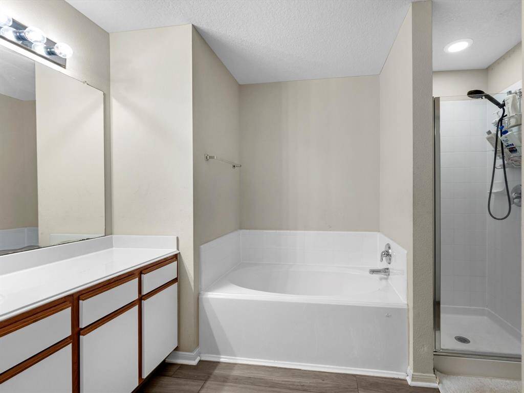 Primary Bedroom Bathroom with shower and experience the upgraded relaxing soaking tub