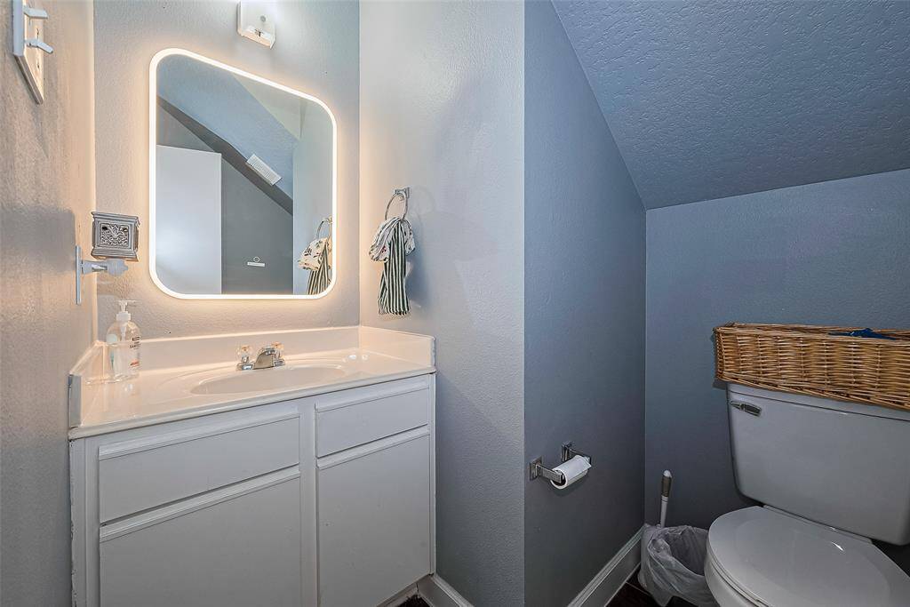 1/2 Bath located on 1st Floor across laundry room. SIZE