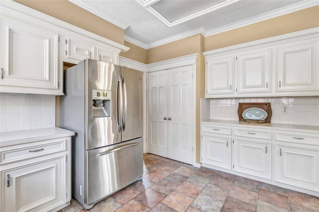 Lots of kitchen cabinets for storage  and counter space for meal prep!