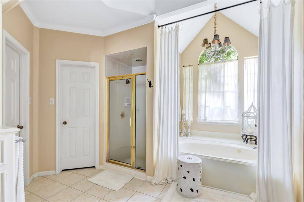 Primary Bath with soaking jetted tub and walk in shower