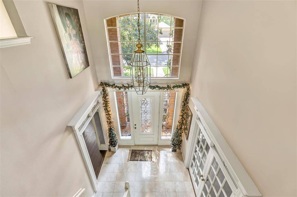 Looking down to the Foyer and Front entry.
