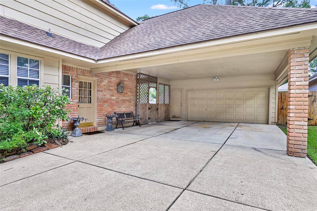 Double car garage with a Porte Cache and covered breezeway to the garage