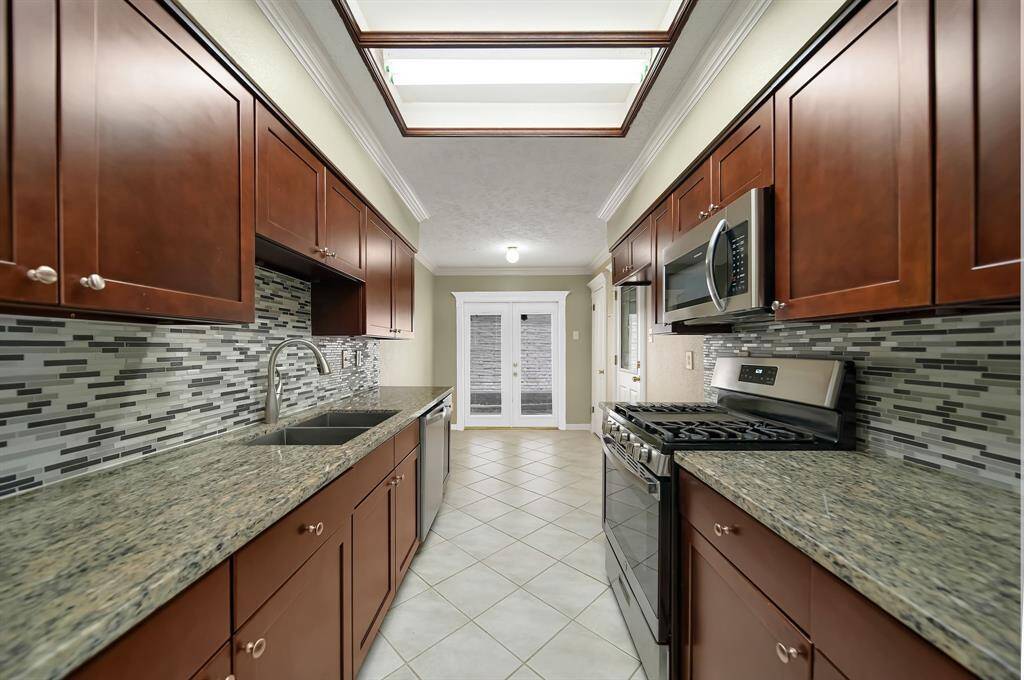 Granite countertops and mosaic  backsplash