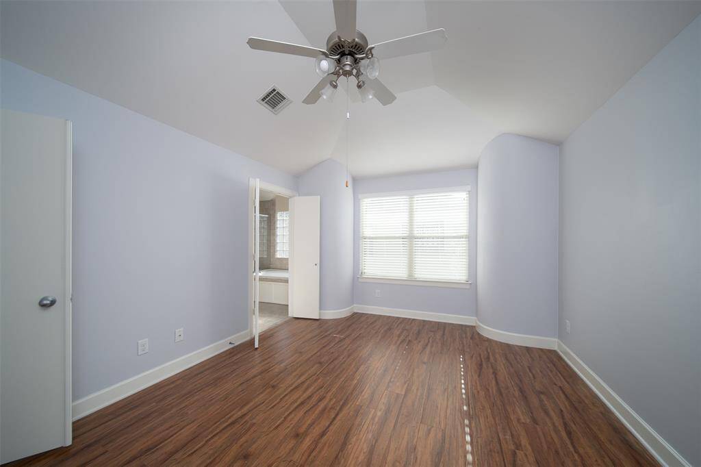 Master bedroom with vaulted ceiling