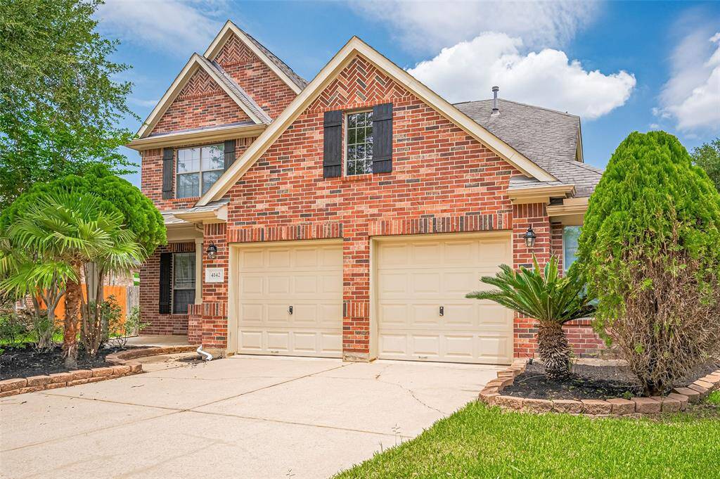 Spacious cul-de-sac lot with lush landscaping.