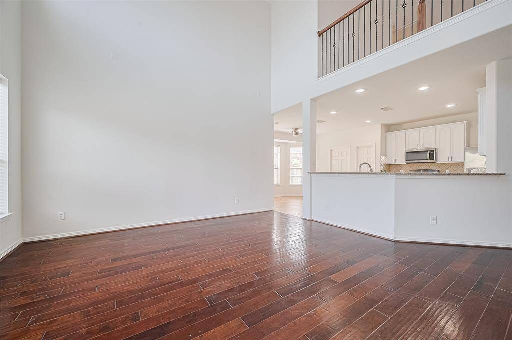 The open kitchen layout flows seamlessly into dining and living areas—ideal for hosting with ease.
