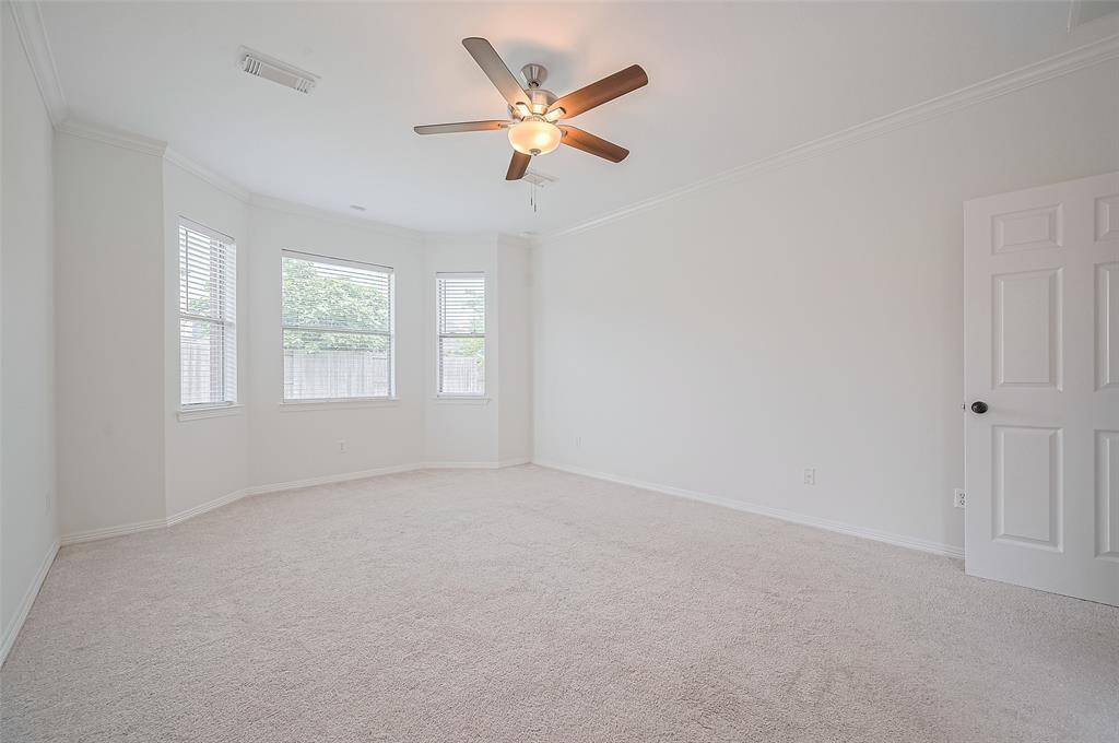 Featuring a charming bay window that invites natural light and creates the perfect reading or sitting nook.