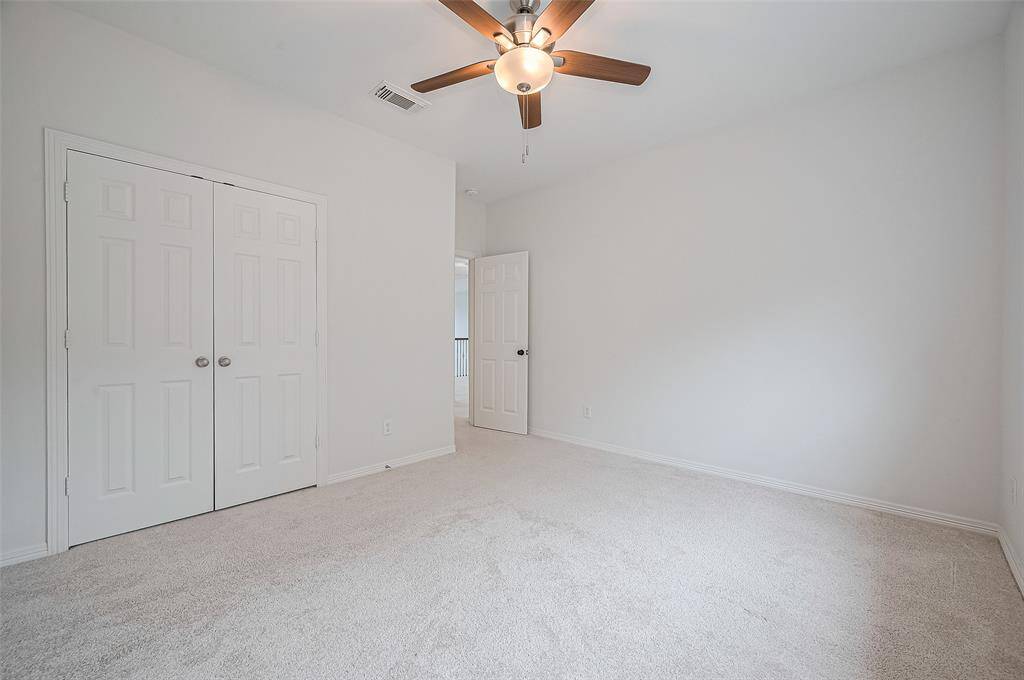 This bedroom is the perfect escape—dim the lights, turn on the fan, and wind down in peace.