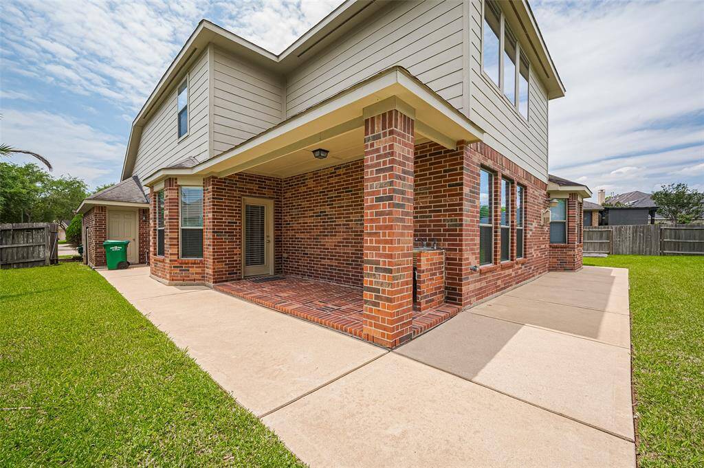 This bricked patio blends classic design with modern functionality—perfect for relaxing or entertaining outdoors.