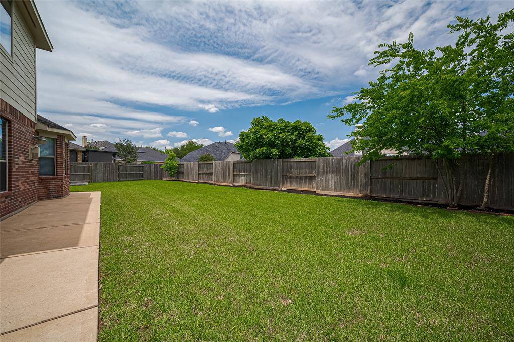 Unwind under golden skies in a backyard that captures the best of every Texas evening.