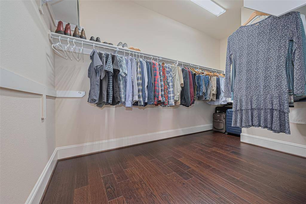 The primary closet has ample storage for two
