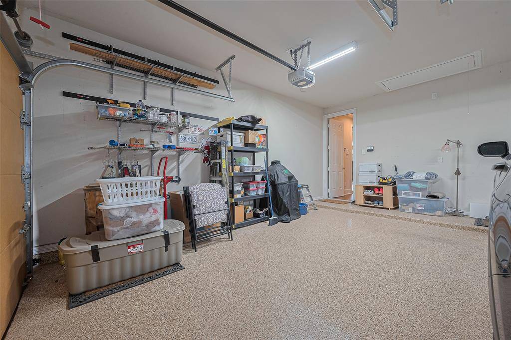 The epoxy flooring is low maintenance and certainly enhances the appearance of the garage!