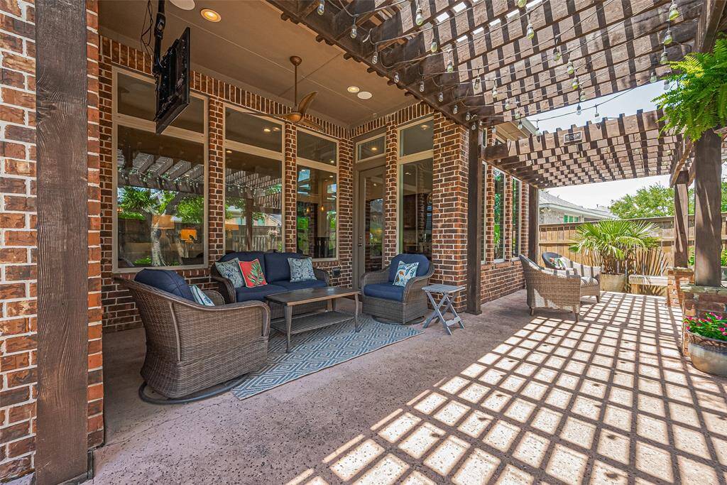 The outdoor area features an updated ceiling fan, mounted TV (which conveys with the home) and wired for sound.  The patio has also been plumbed with gas for a future outdoor kitchen.