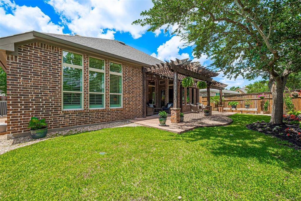 The gardner in you will love the low maintenance, established landscaping