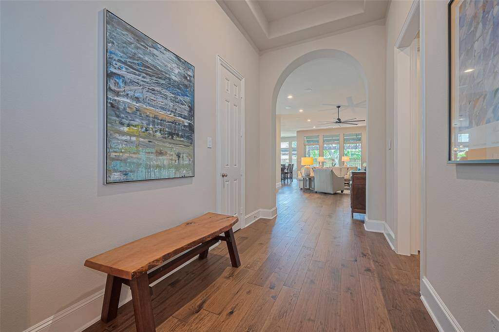 As you enter, this view extends toward the spacious family room, creating an open and connected feel. Three secondary bedrooms are positioned at the front of the home, while the private primary suite is tucked away at the back providing a peaceful retreat from the rest of the home.