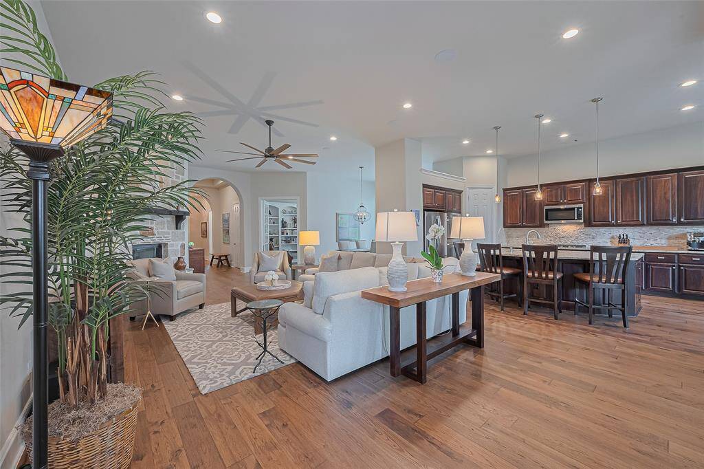 This alternate view highlights the thoughtfully designed floorplan, showcasing the private office, formal dining room, kitchen, and family room—all seamlessly connected in an open-concept layout that's perfect for entertaining.