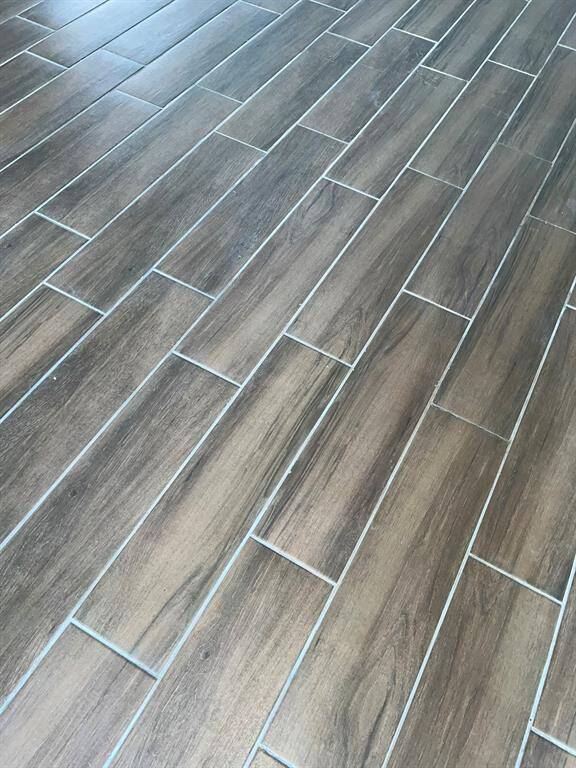 Hardwood like tile throughout the entire home.
