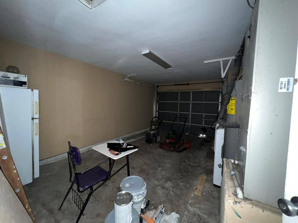 this 1 car attached garage can be used for extra storage or to house your car.